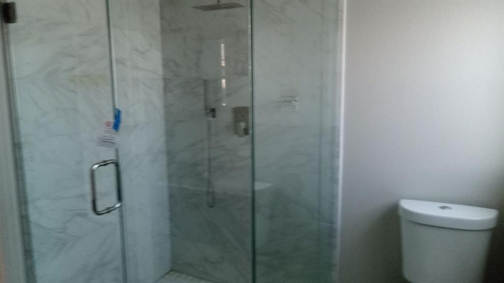 1510 Carson Street Dallas, TX 75216 - Photo 10 of 29 a bathroom with a shower and a toilet