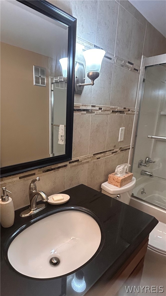 4547 Chestnut Ridge Road, Unit 219B Amherst, NY 14228 - Photo 19 of 36 Beautifully tiled bathroom