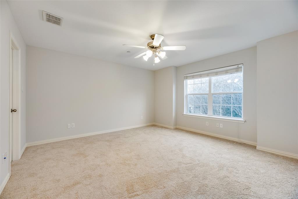2320 Durango Ridge Drive Bedford, TX 76021 - Photo 13 of 21 an empty room with a window and a ceiling fan