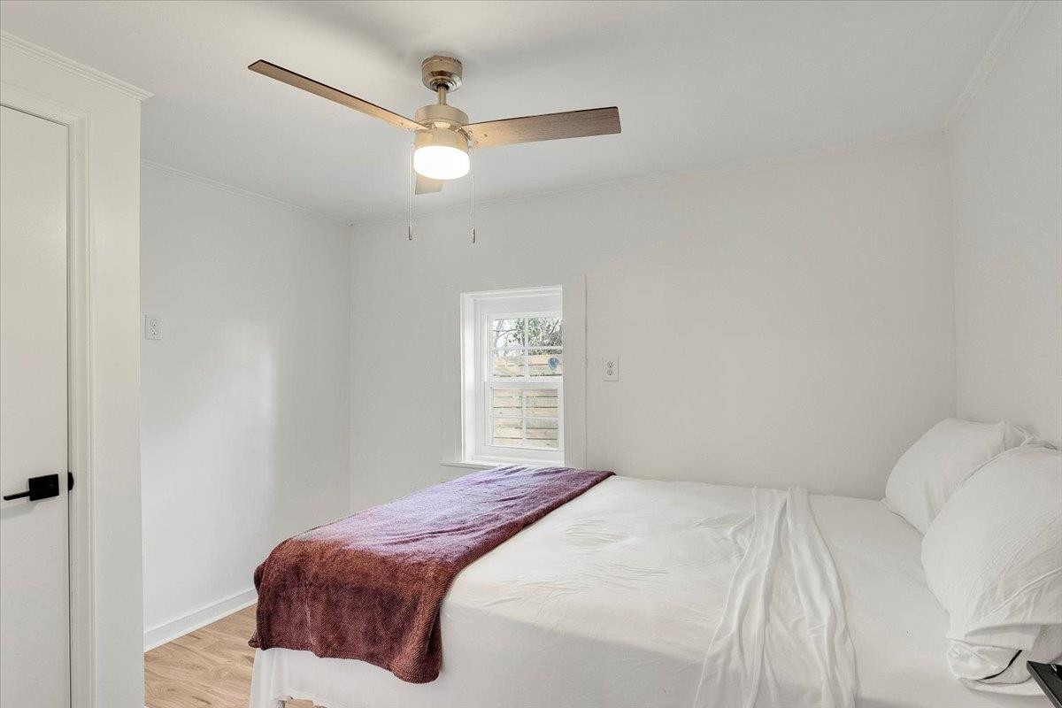 211 North State Street Raleigh, NC 27601 - Photo 13 of 50 a bedroom with a bed and a window