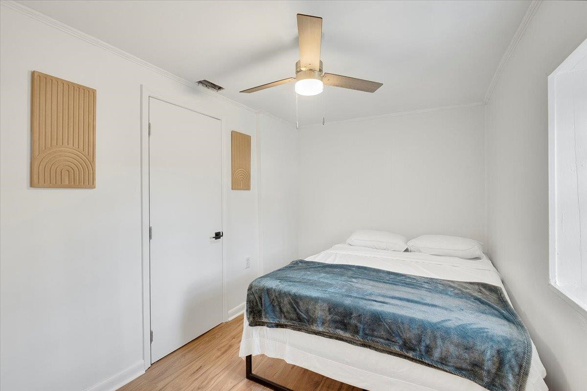 211 North State Street Raleigh, NC 27601 - Photo 17 of 50 a bedroom with a bed and a window
