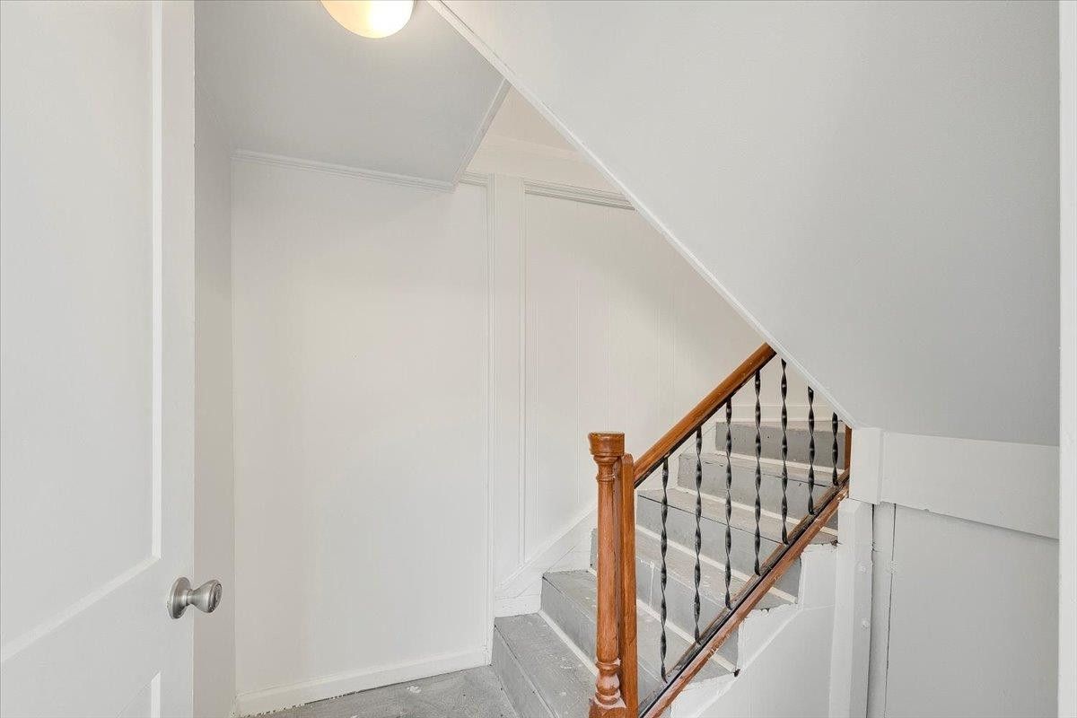 211 North State Street Raleigh, NC 27601 - Photo 26 of 50 a view of staircase with railing and white walls