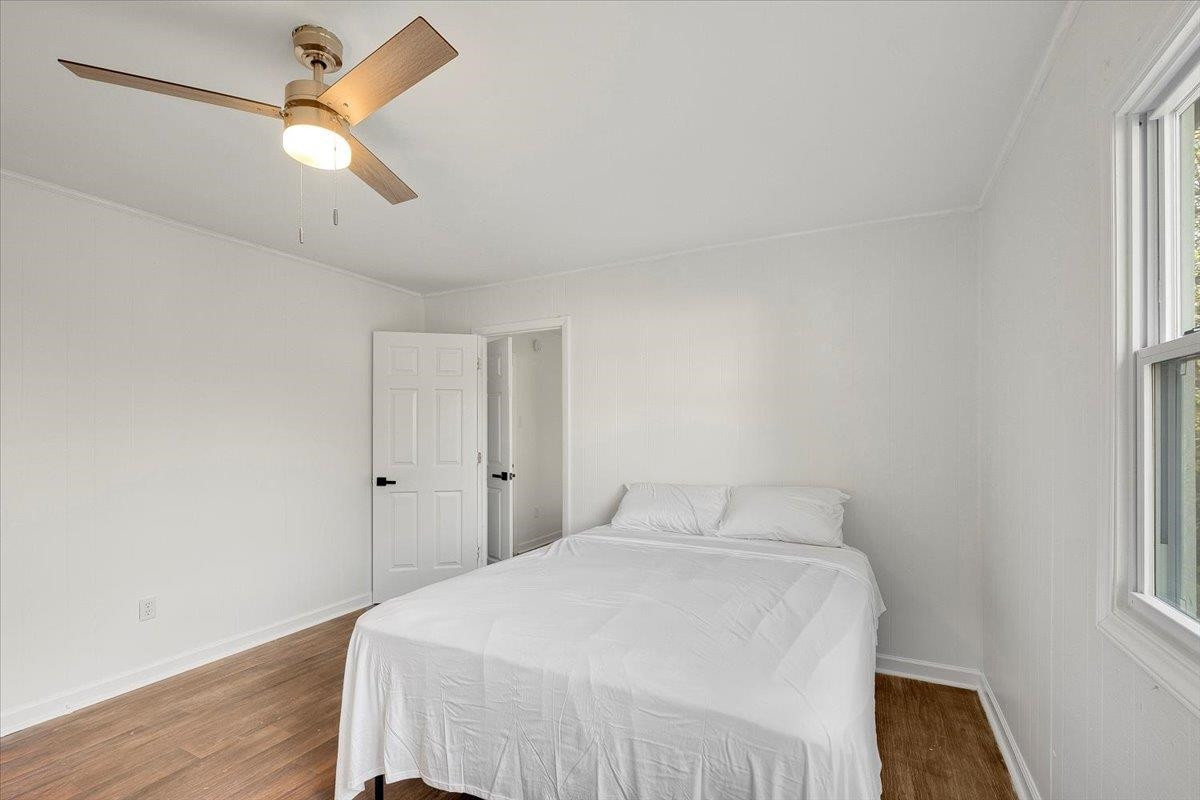 211 North State Street Raleigh, NC 27601 - Photo 33 of 50 a bedroom with a bed and a window