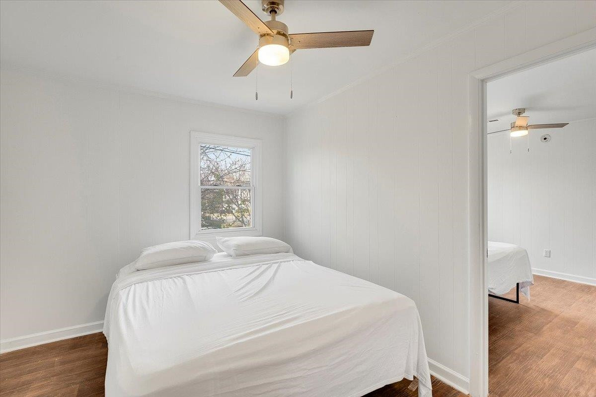 211 North State Street Raleigh, NC 27601 - Photo 35 of 50 a bedroom with a bed and a window