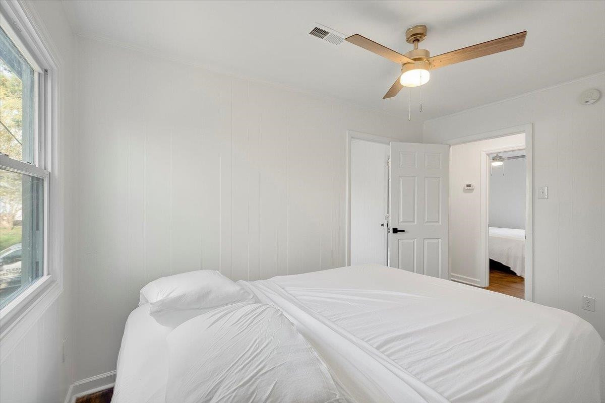 211 North State Street Raleigh, NC 27601 - Photo 36 of 50 a bedroom with a bed and a window