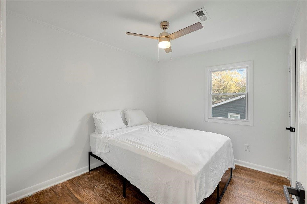 211 North State Street Raleigh, NC 27601 - Photo 37 of 50 a bedroom with a bed and a window