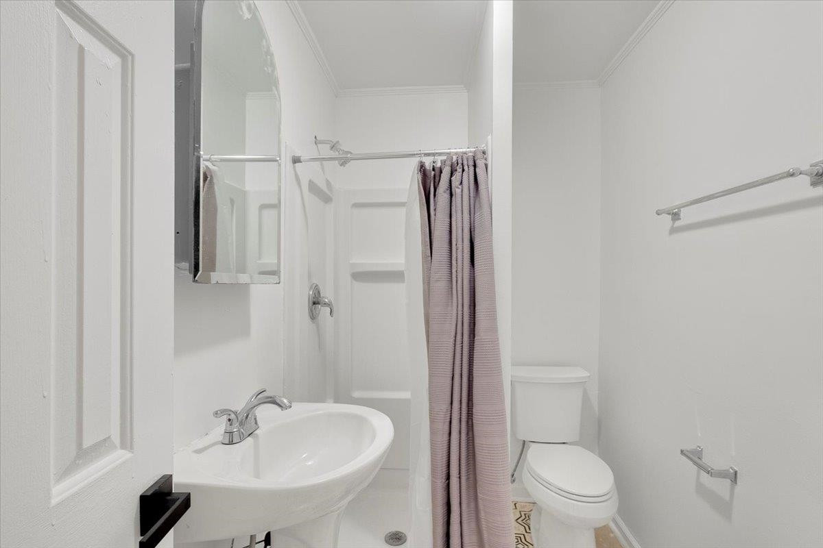 211 North State Street Raleigh, NC 27601 - Photo 40 of 50 a bathroom with a sink toilet and shower