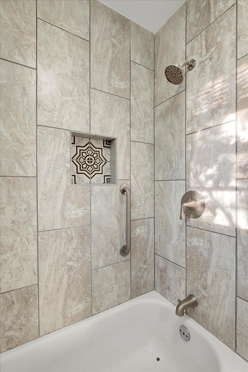 211 North State Street Raleigh, NC 27601 - Photo 43 of 50 a bathroom with a bathtub and shower