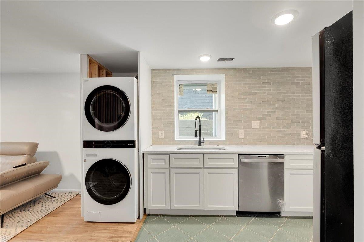 211 North State Street Raleigh, NC 27601 - Photo 8 of 50 a view of a kitchen with a sink a washer and dryer