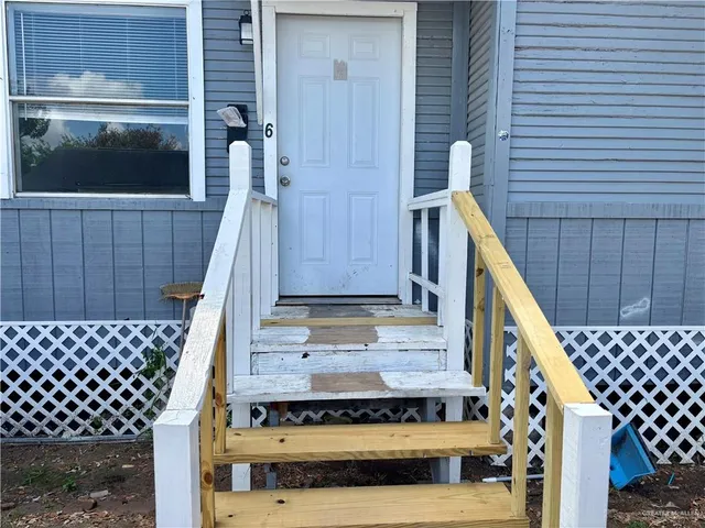a view of wooden balcony with furniture