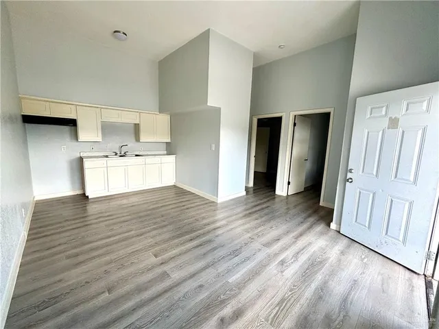a view of a kitchen with wooden floor