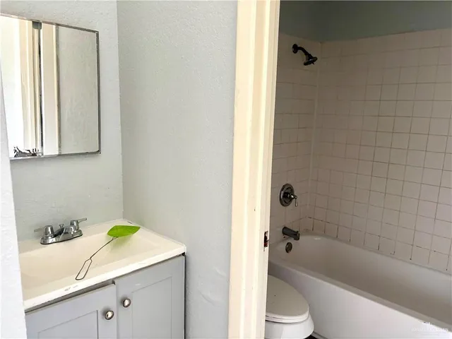 a bathroom with a sink toilet and bathtub