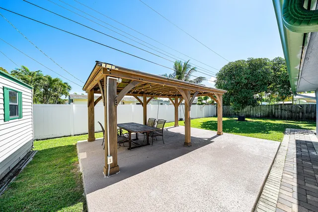 a view of a backyard with a small cabin