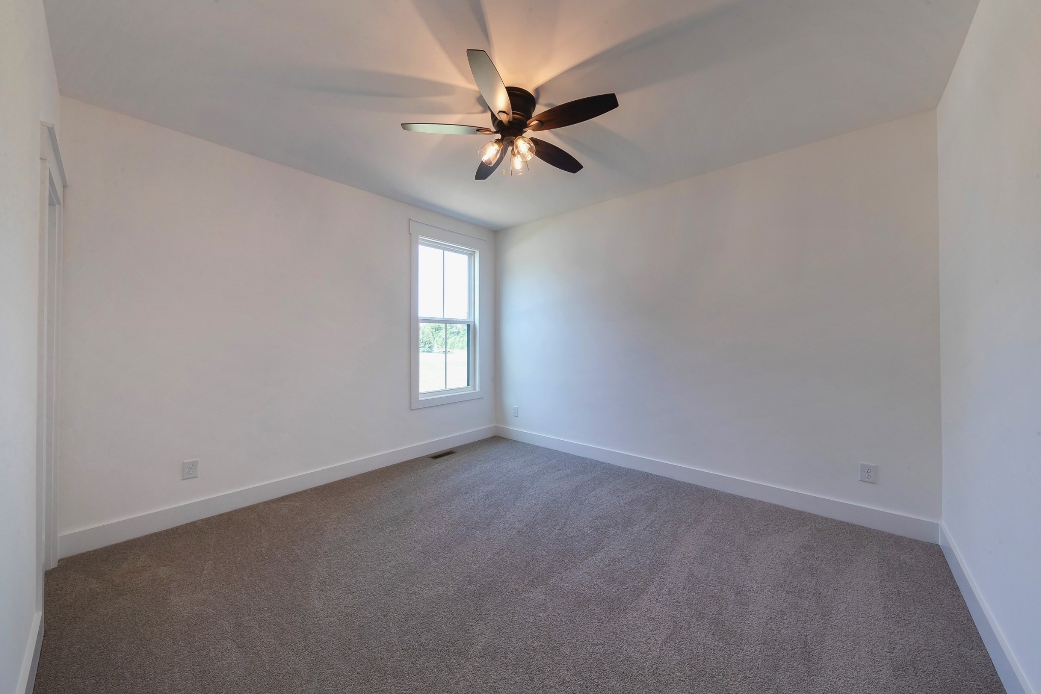 6616 Old Zion Road Columbia, TN 38401 - Photo 11 of 52 an empty room with a window and a fan