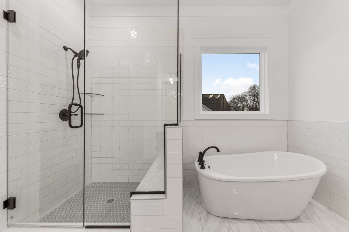 6616 Old Zion Road Columbia, TN 38401 - Photo 11 of 29 a white bath tub sitting next to a shower