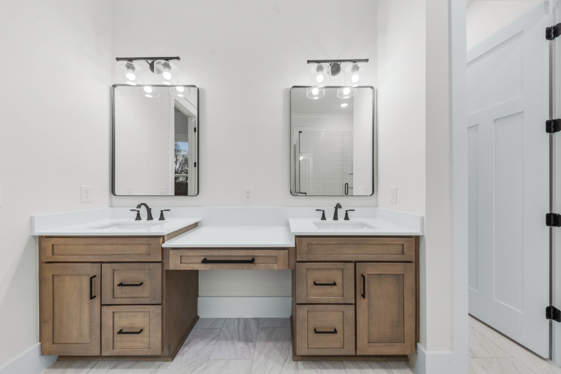 6616 Old Zion Road Columbia, TN 38401 - Photo 12 of 29 a bathroom with a double vanity sink mirror and