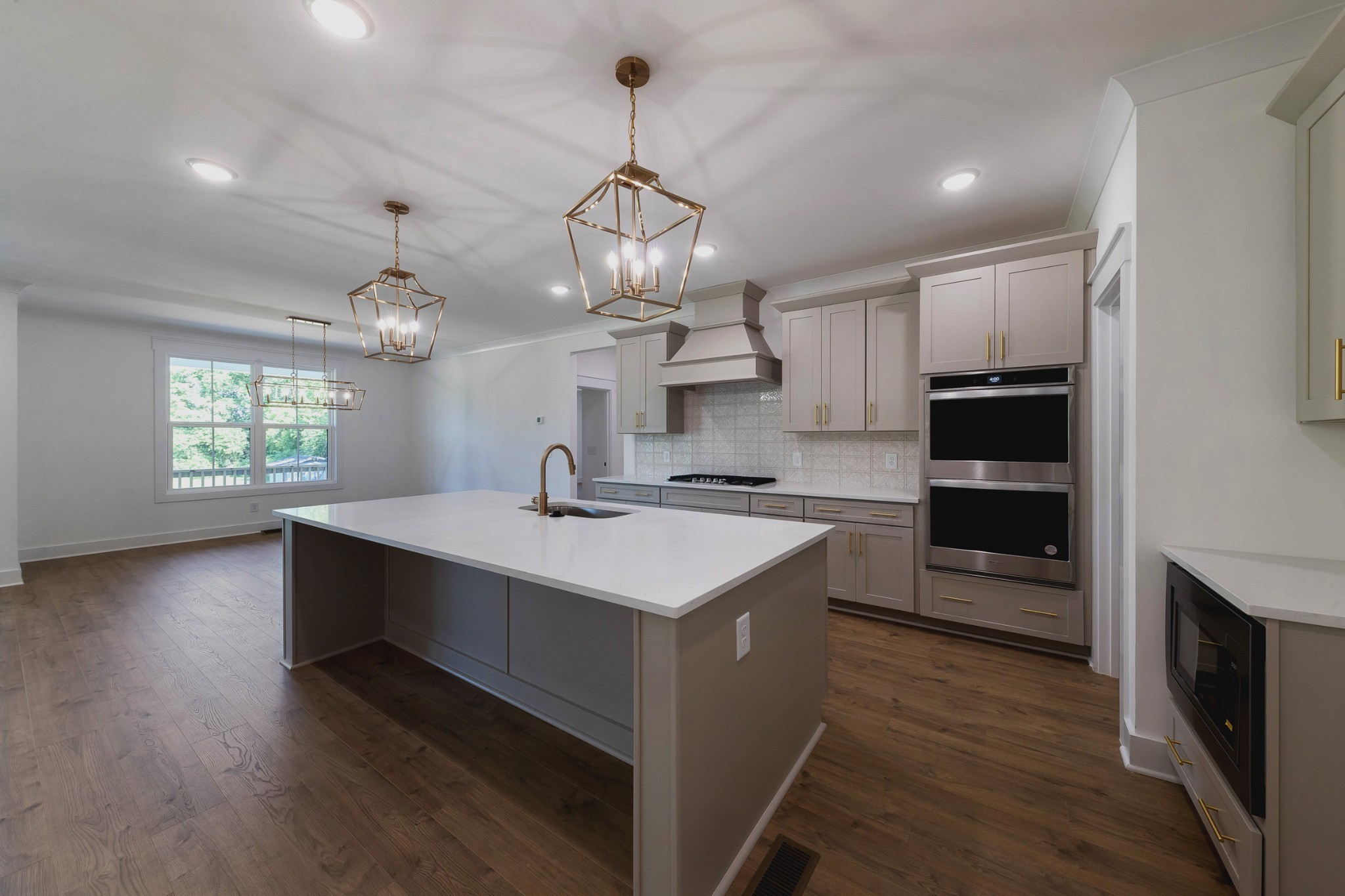6616 Old Zion Road Columbia, TN 38401 - Photo 14 of 52 a kitchen with kitchen island granite countertop a sink cabinets and wooden floor