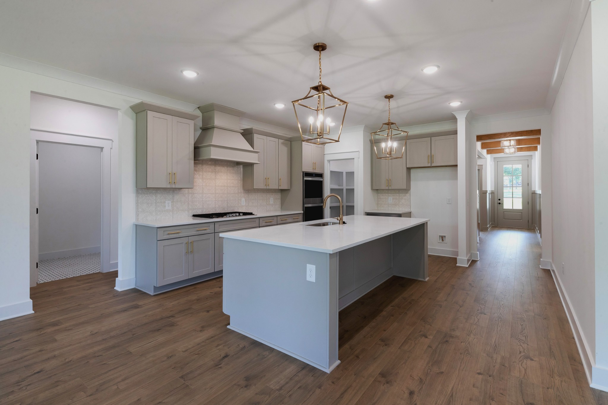 6616 Old Zion Road Columbia, TN 38401 - Photo 16 of 52 a large kitchen with stainless steel appliances a large counter top a sink a refrigerator and a window