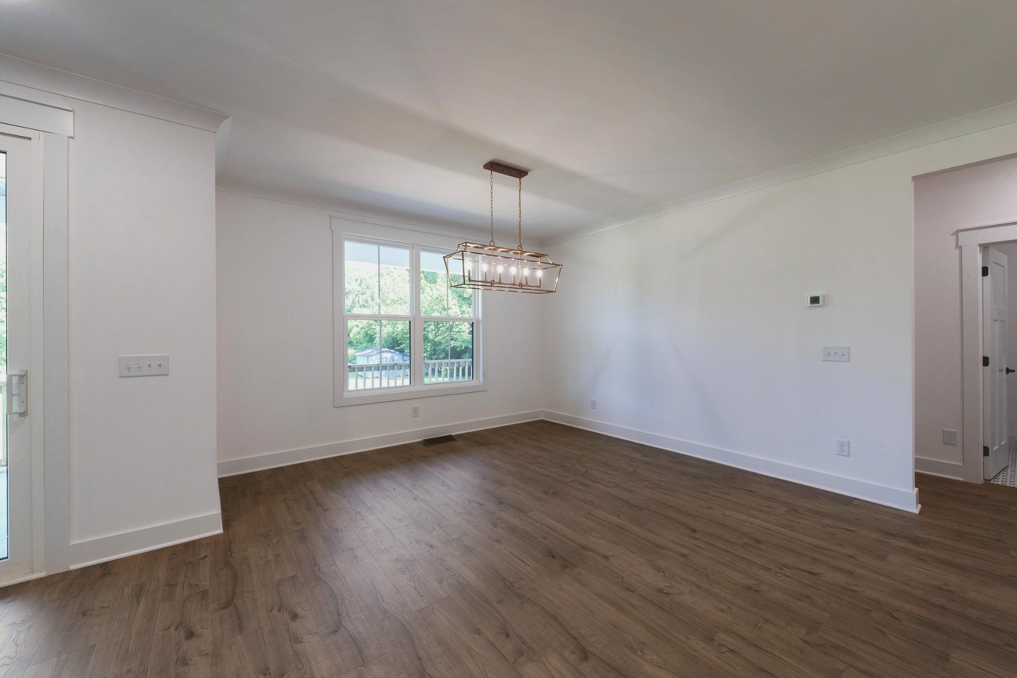 6616 Old Zion Road Columbia, TN 38401 - Photo 20 of 52 an empty room with wooden floor and windows