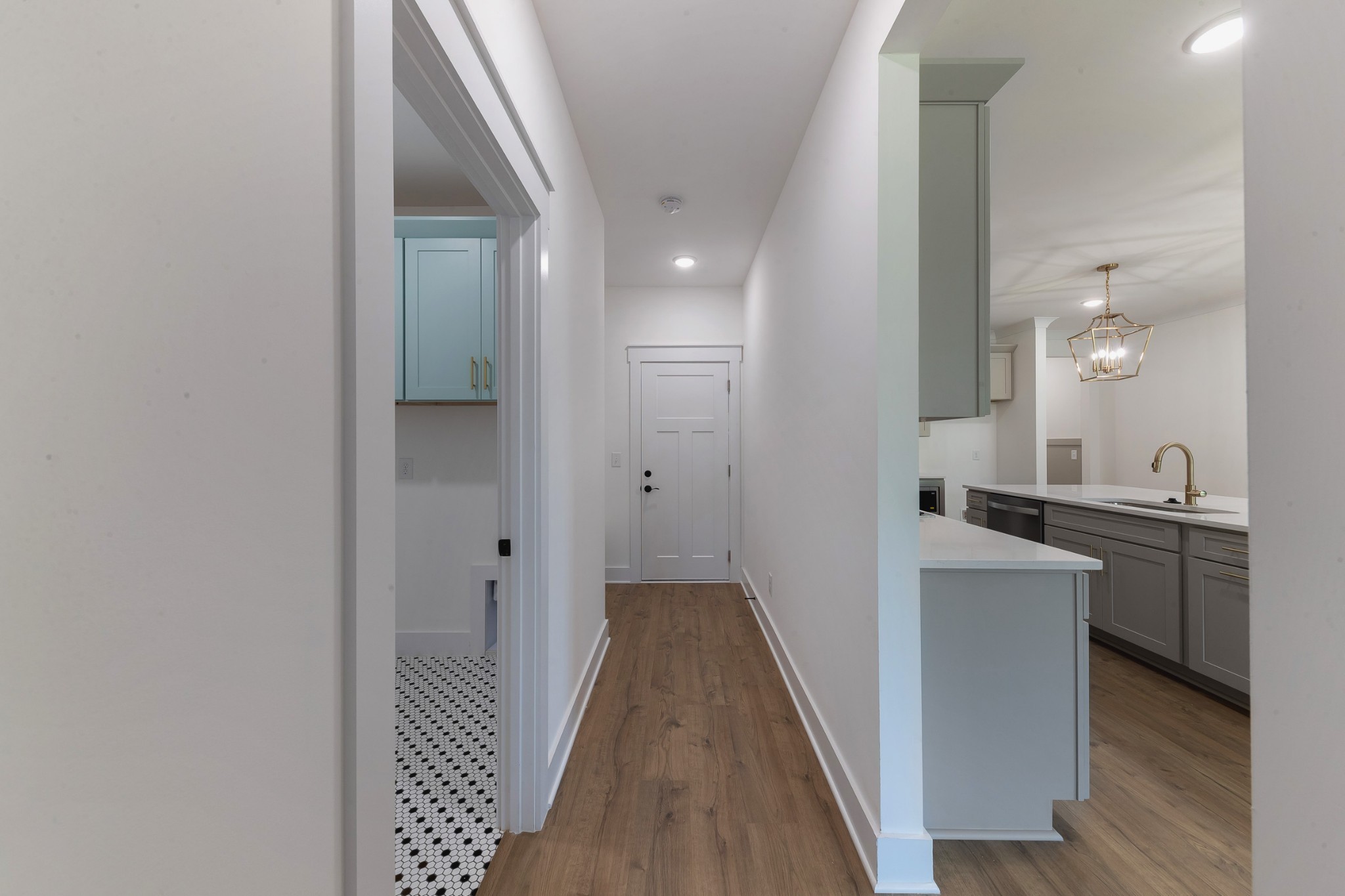 6616 Old Zion Road Columbia, TN 38401 - Photo 28 of 52 a view of a hallway with wooden floor and a sink