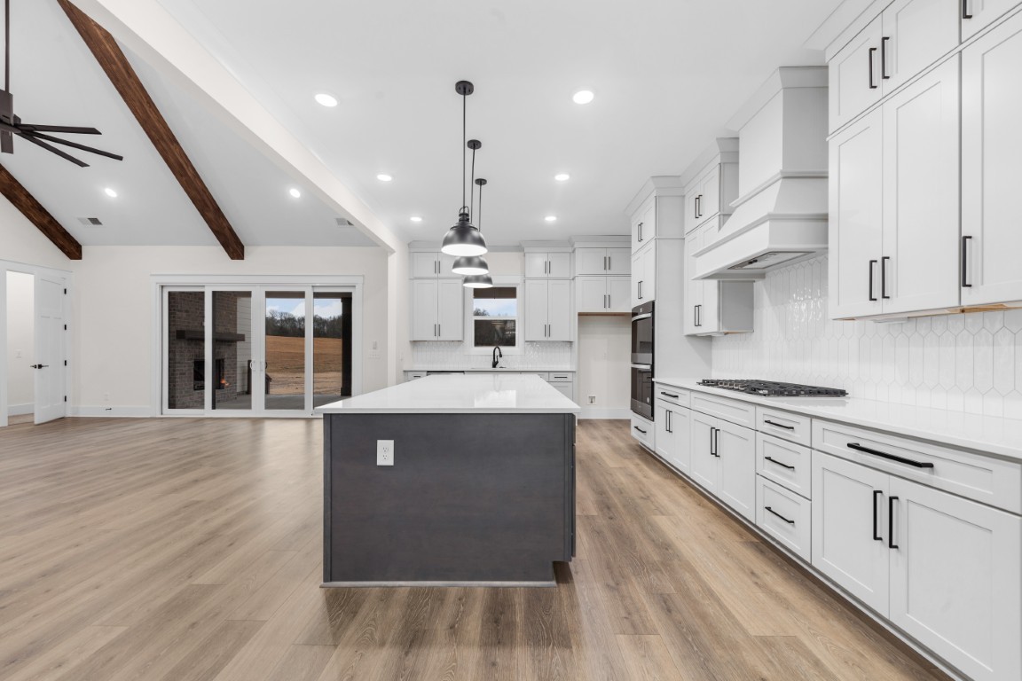 6616 Old Zion Road Columbia, TN 38401 - Photo 6 of 29 a kitchen with stainless steel appliances granite countertop a stove and a refrigerator