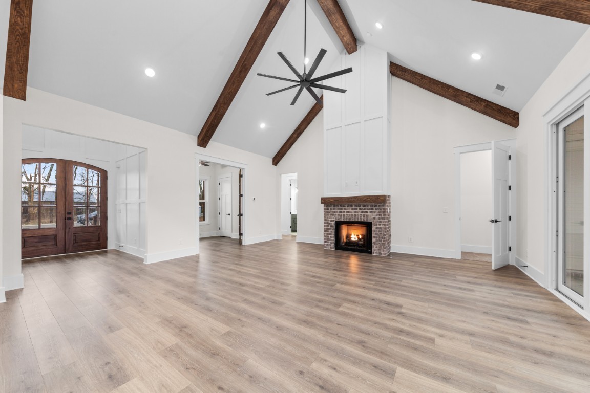 6616 Old Zion Road Columbia, TN 38401 - Photo 9 of 29 a view of empty room with wooden floor and fireplace