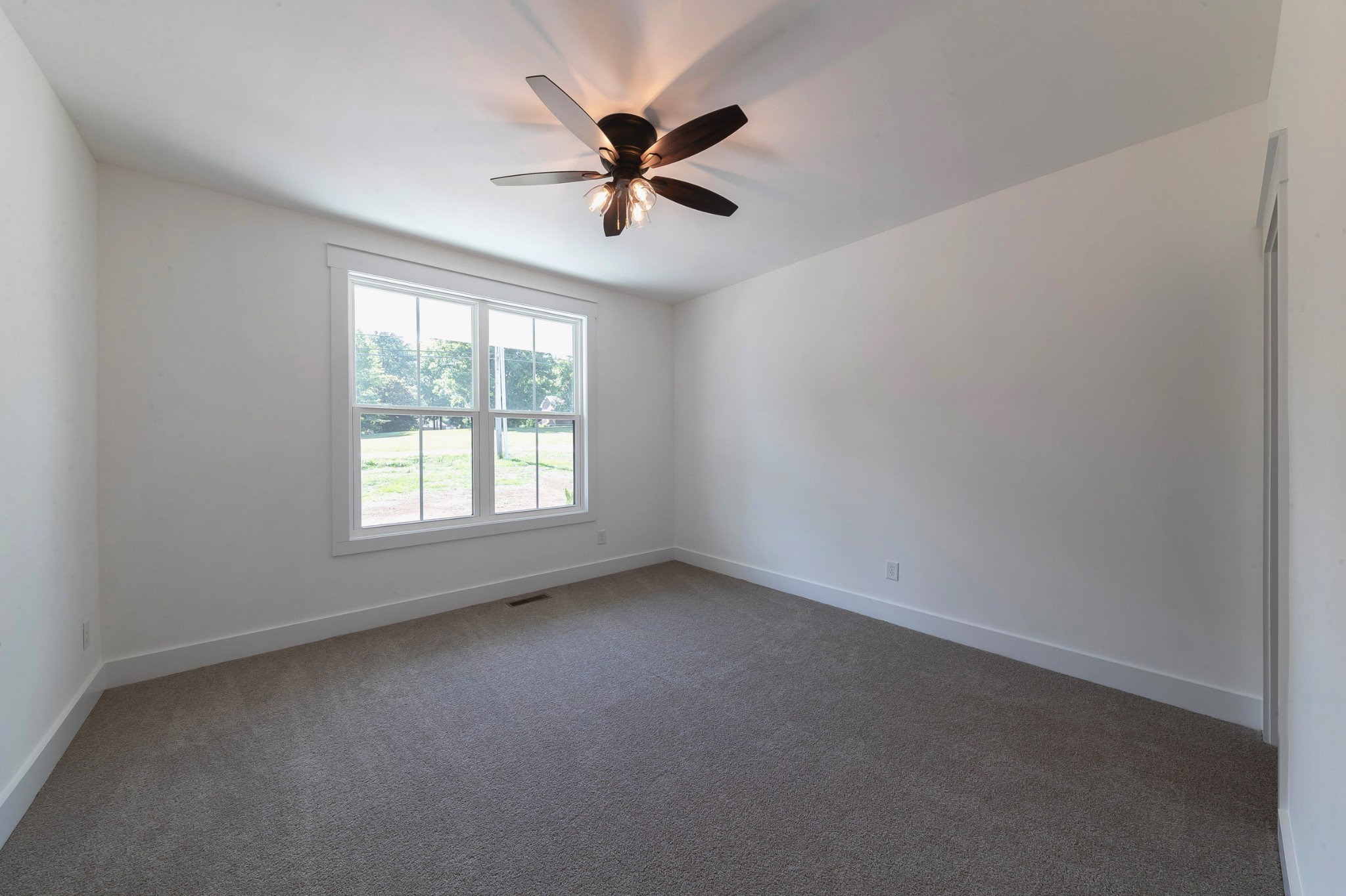6616 Old Zion Road Columbia, TN 38401 - Photo 10 of 52 an empty room with a window and a fan