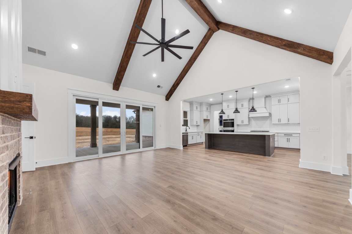 6616 Old Zion Road Columbia, TN 38401 - Photo 10 of 29 a view of a kitchen with cabinets and wooden floor