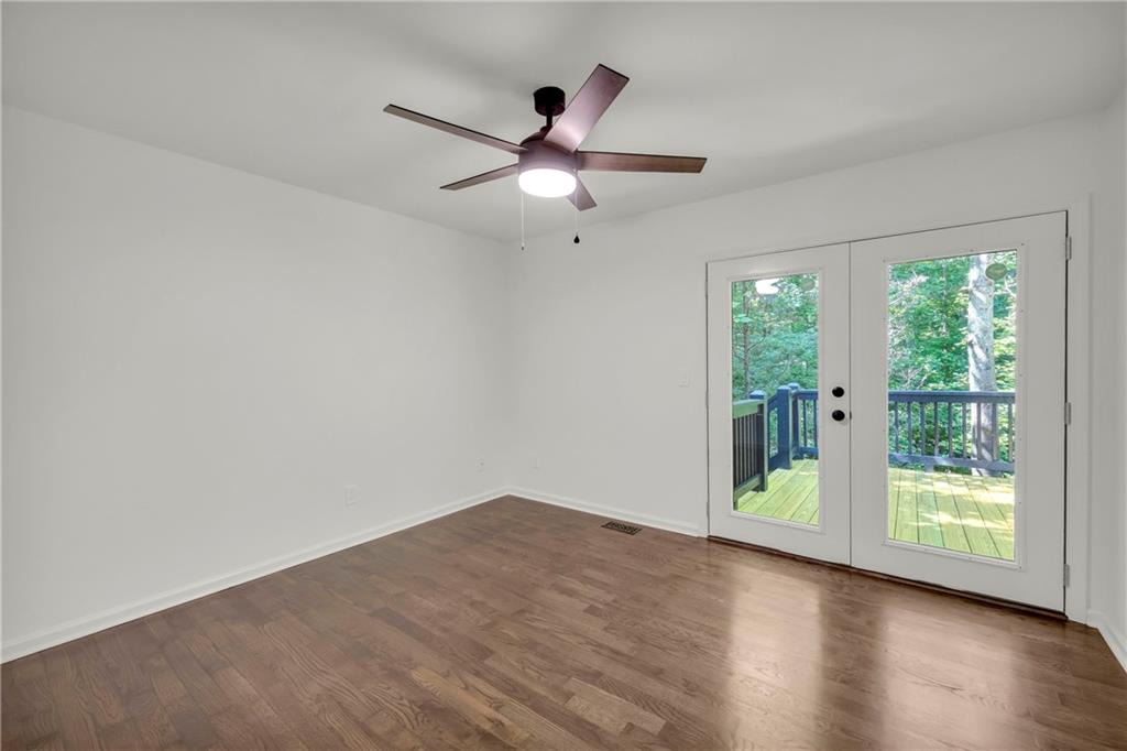 2941 Lake Hollow Road Gainesville, GA 30501 - Photo 36 of 53 a view of empty room with wooden floor and fan