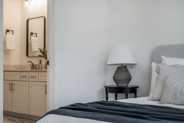 a room with a sink and a mirror