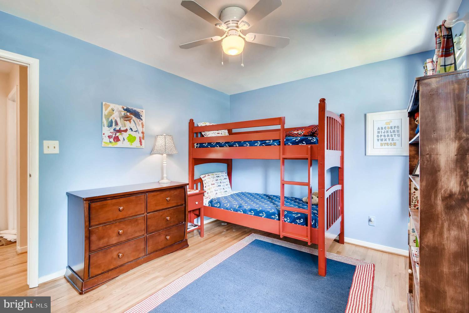 10510 Longbranch Road Cockeysville, MD 21030 - Photo 16 of 28 a bedroom with bed and a chandelier