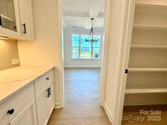 a view of walk in closet with window