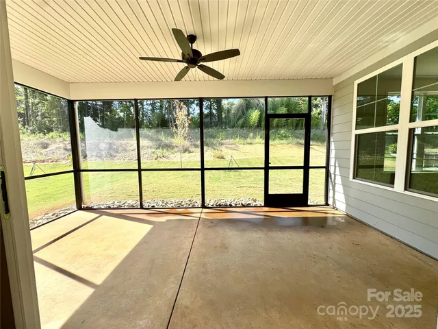 a view of an empty room with a large window
