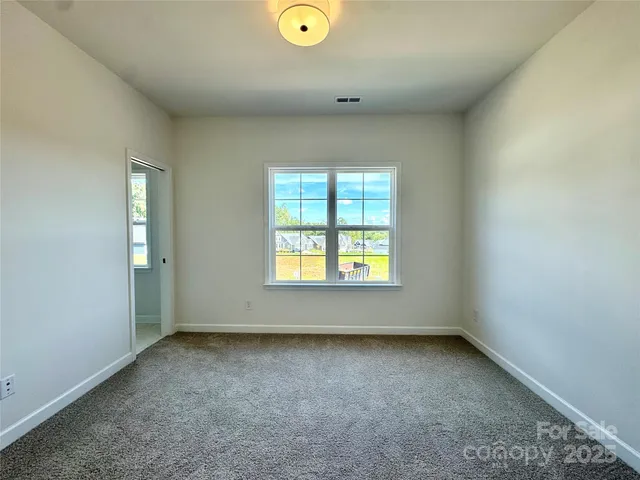 a view of an entryway with wooden floor and windows