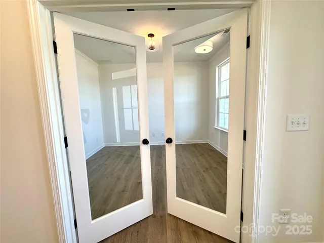 a view of a bathroom from a hallway