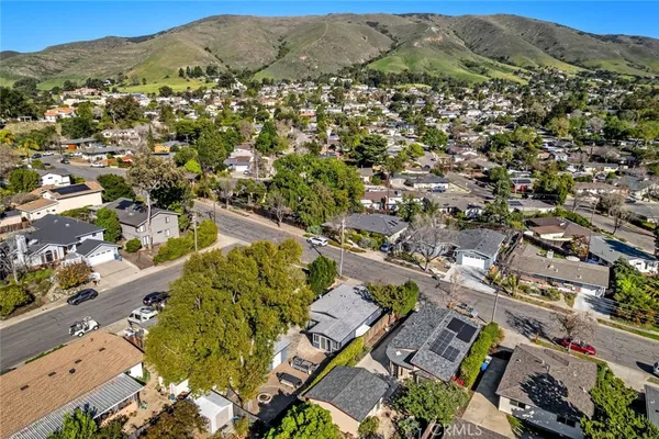an aerial view of residential houses with outdoor space