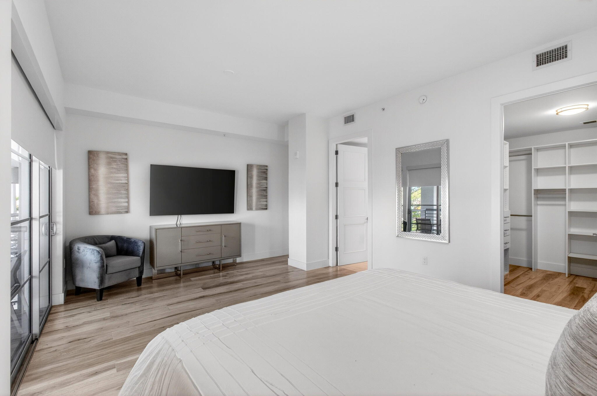 155 East Boca Raton Road, Unit TH3 Boca Raton, FL 33432 - Photo 58 of 139 a bedroom with furniture and a flat screen tv