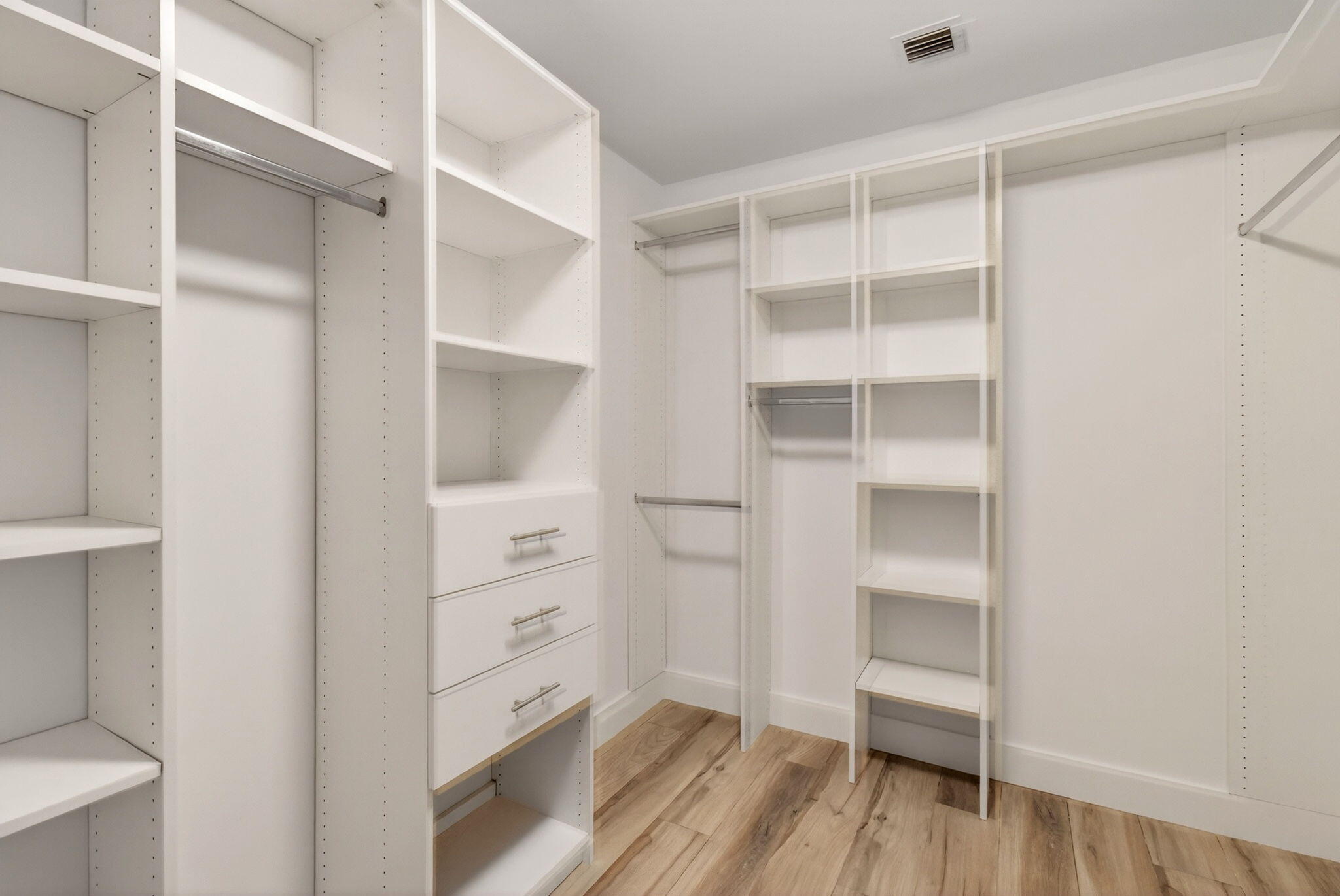 155 East Boca Raton Road, Unit TH3 Boca Raton, FL 33432 - Photo 60 of 139 a view of walk in closet with empty racks
