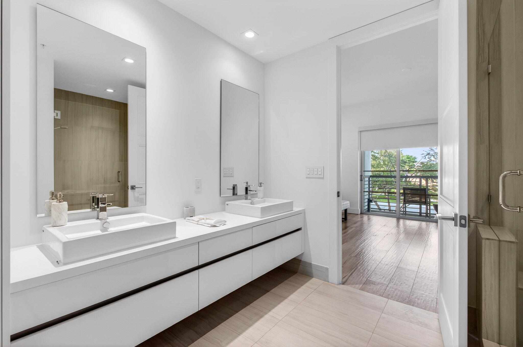 155 East Boca Raton Road, Unit TH3 Boca Raton, FL 33432 - Photo 63 of 139 a en suite bathroom with a double vanity sink and mirror