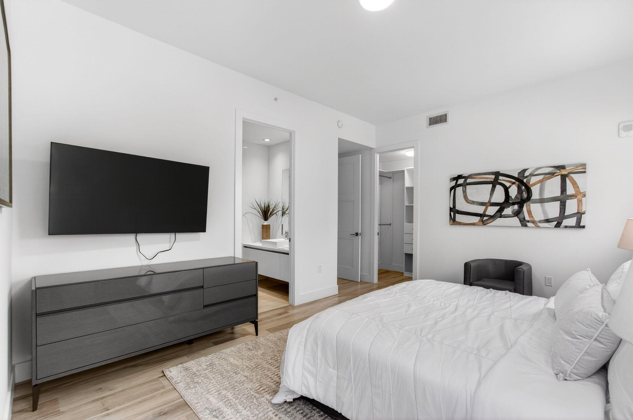 155 East Boca Raton Road, Unit TH3 Boca Raton, FL 33432 - Photo 66 of 139 a bedroom with a bed and a flat screen tv