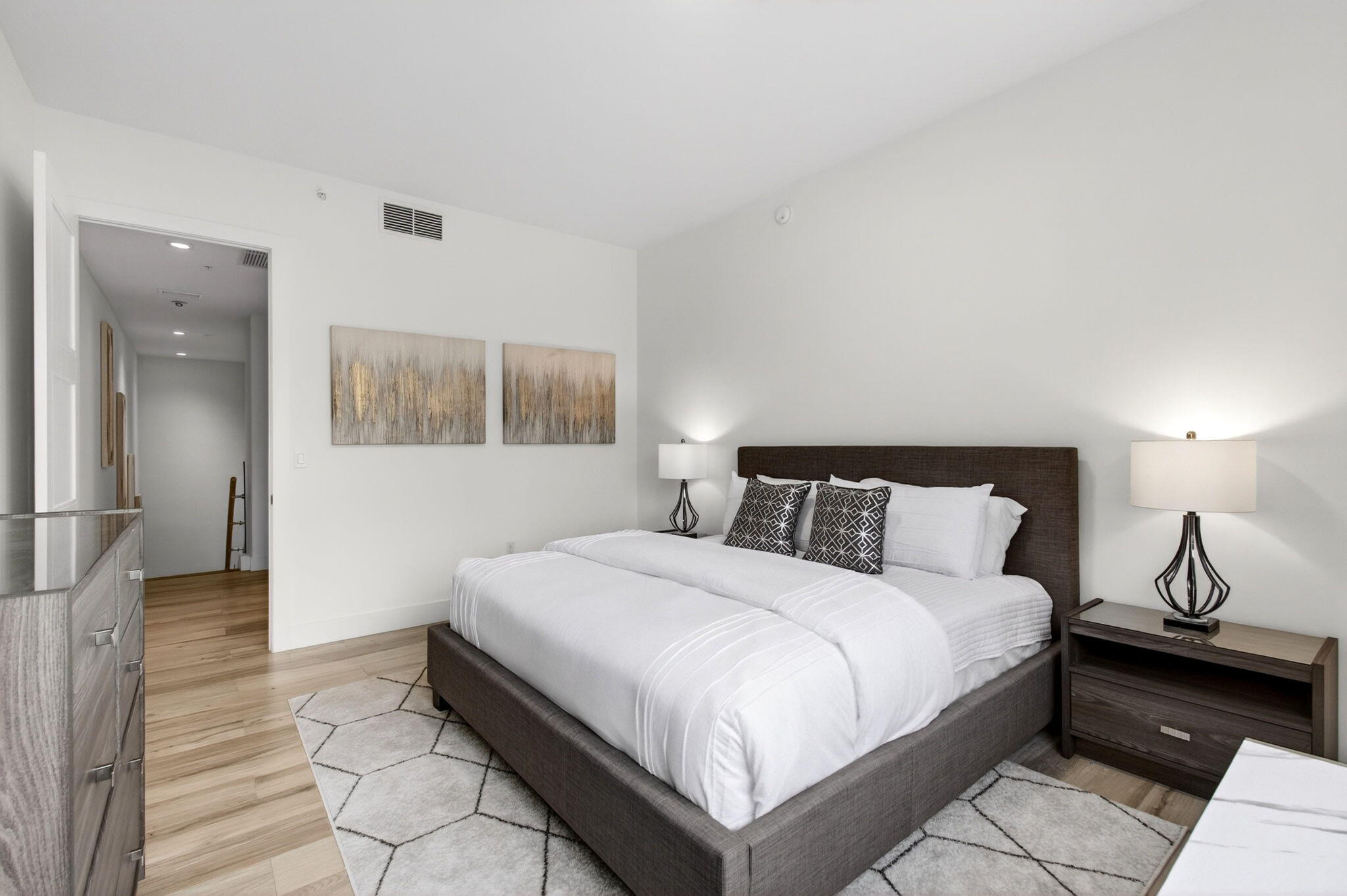 155 East Boca Raton Road, Unit TH3 Boca Raton, FL 33432 - Photo 75 of 139 a bedroom with a bed and wooden floor