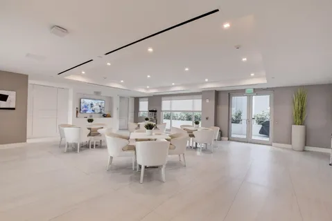 a bedroom with furniture and a flat screen tv