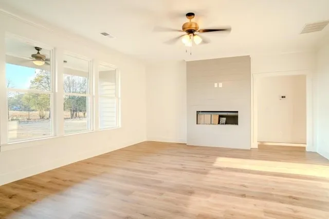 a view of an empty room with a window