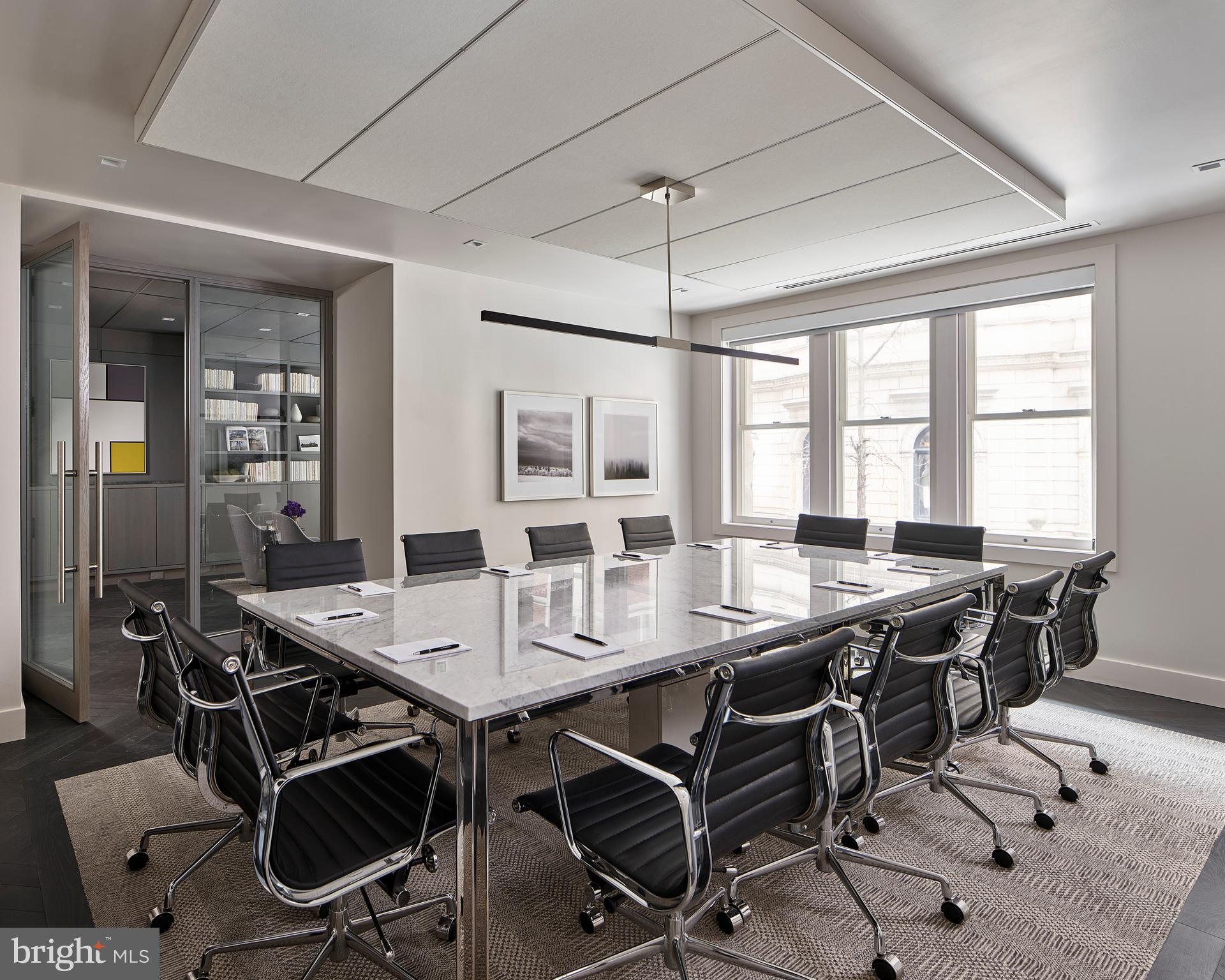 135 South 18th Street, Unit 1BED Philadelphia, PA 19103 - Photo 10 of 14 a view of a dining room with furniture window and wooden floor