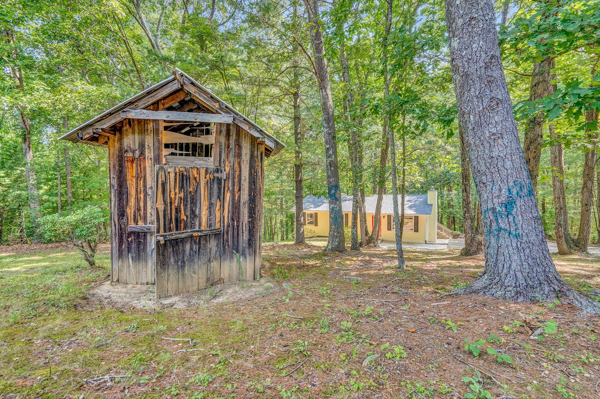 854 Harmony Road Boones Mill, VA 24065 - Photo 12 of 16 a front view of a house with a yard table and chairs