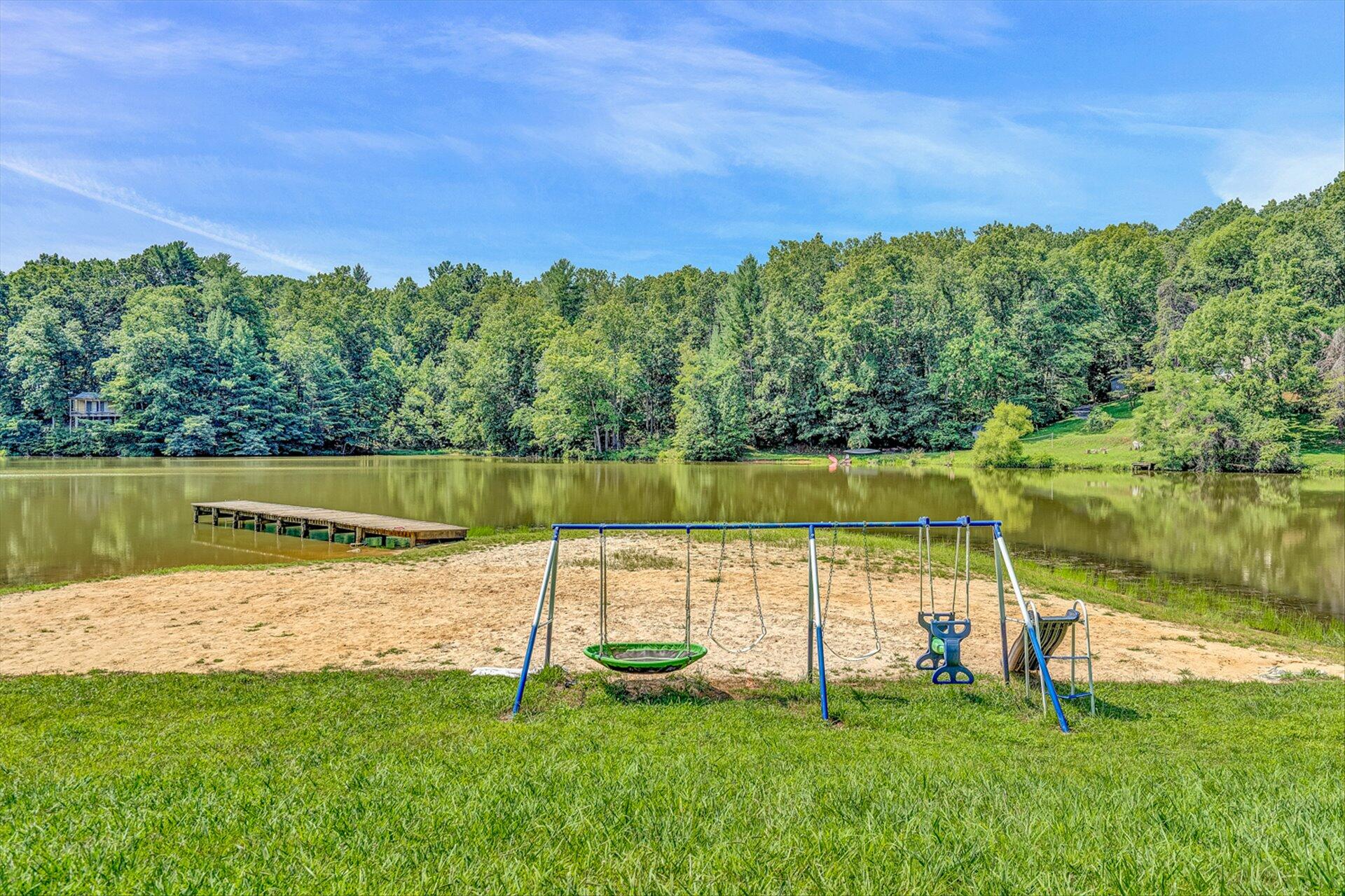 854 Harmony Road Boones Mill, VA 24065 - Photo 13 of 16 a view of a garden with a lake