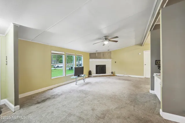 a view of an empty room with a window