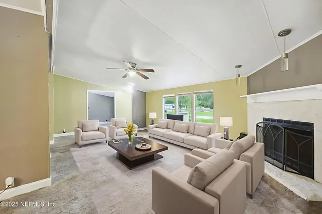 a living room with furniture and a fireplace