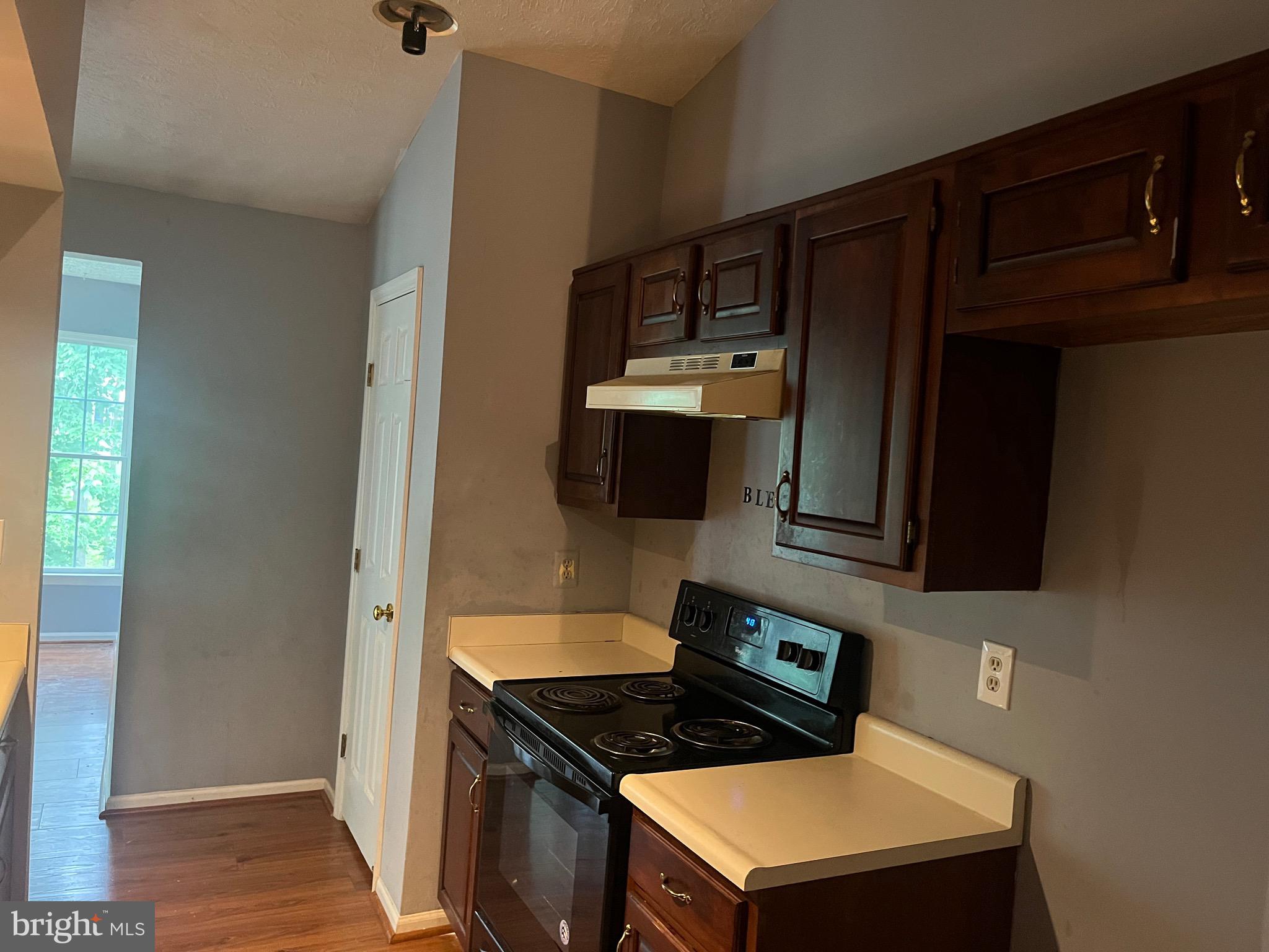 903 K Woodbridge Court, Unit 903K Edgewood, MD 21040 - Photo 2 of 9 a kitchen with stainless steel appliances a stove and a microwave