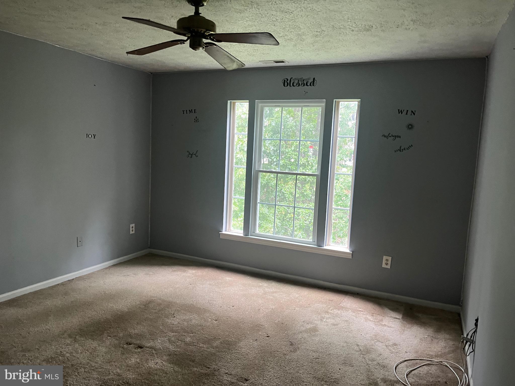 903 K Woodbridge Court, Unit 903K Edgewood, MD 21040 - Photo 5 of 9 an empty room with a window and a fan